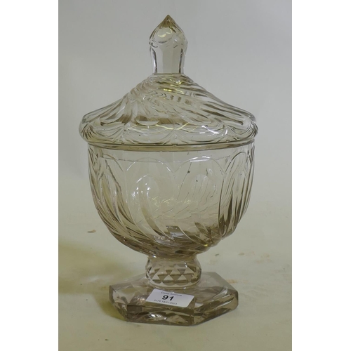 91 - A C19th glass sweetmeat/preserve jar and cover, raised on a pedestal base of good colour, 26cm high