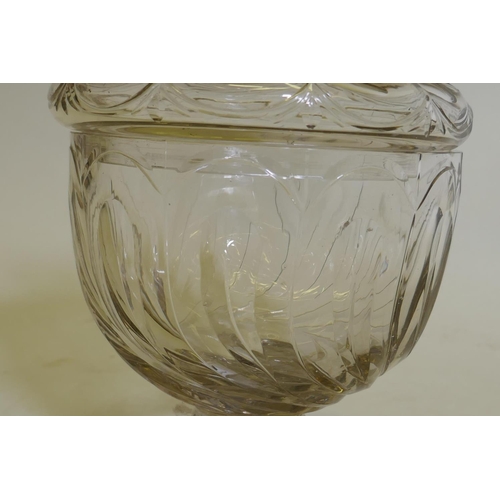 91 - A C19th glass sweetmeat/preserve jar and cover, raised on a pedestal base of good colour, 26cm high