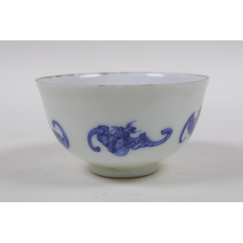 93 - A blue and white porcelain tea bowl with bat decoration, Chinese KangXi 6 character mark to base, 8c... 