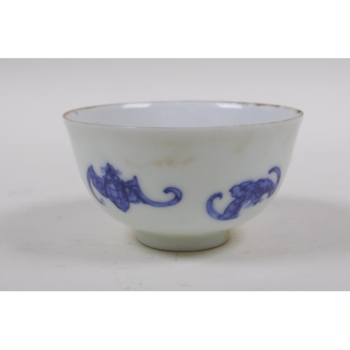 93 - A blue and white porcelain tea bowl with bat decoration, Chinese KangXi 6 character mark to base, 8c... 