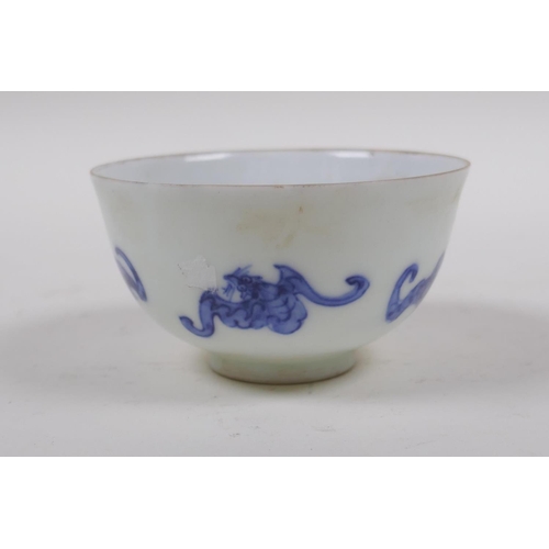 93 - A blue and white porcelain tea bowl with bat decoration, Chinese KangXi 6 character mark to base, 8c... 