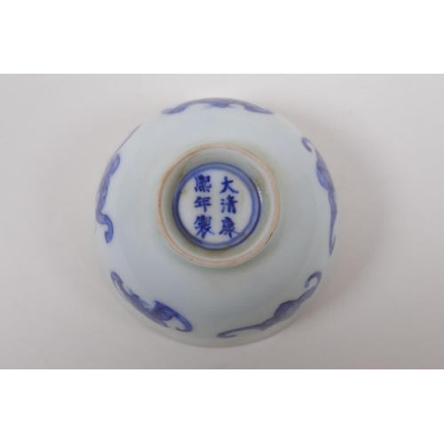 93 - A blue and white porcelain tea bowl with bat decoration, Chinese KangXi 6 character mark to base, 8c... 