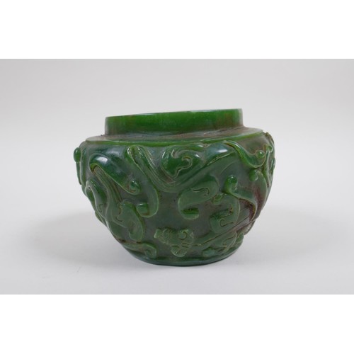 43 - A Chinese reconstitued green hardstone pot with kylin decoration, 13cm diameter