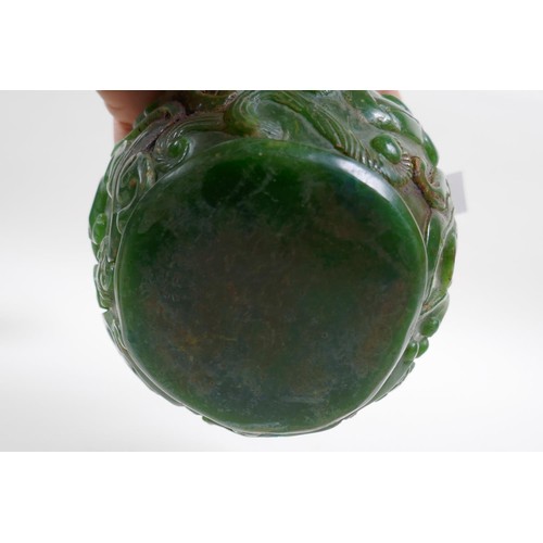 43 - A Chinese reconstitued green hardstone pot with kylin decoration, 13cm diameter