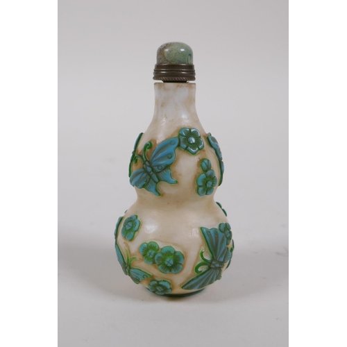 305 - A Peking glass double gourd snuff bottle with raised butterfly decoration, 4 character mark to base,... 