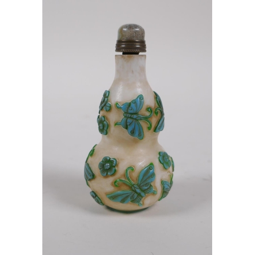 305 - A Peking glass double gourd snuff bottle with raised butterfly decoration, 4 character mark to base,... 