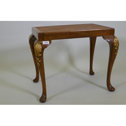 1093 - A Georgian style walnut stool with carved and parcel gilt decoration and cane seat, 56 x 41cm, 45cm ... 