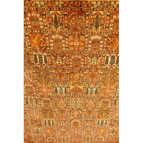 1097 - A Persian Bakhtiar multi-colour ground carpet, with Persian panel design, 335 x 250cm