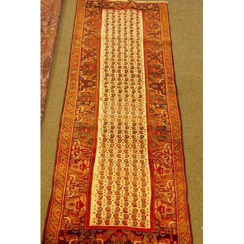 1101 - An Iranian fine woven cream ground wool runner with Mir design, 260 x 100cm