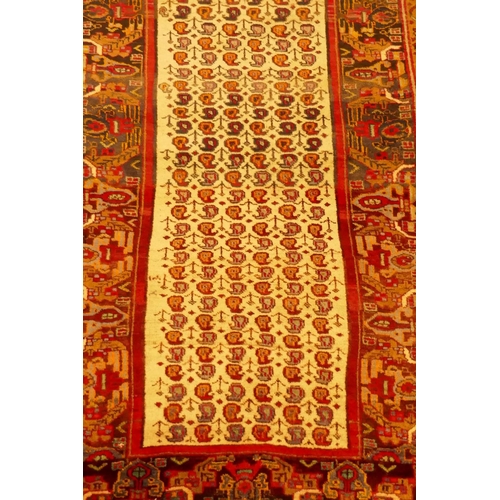 1101 - An Iranian fine woven cream ground wool runner with Mir design, 260 x 100cm