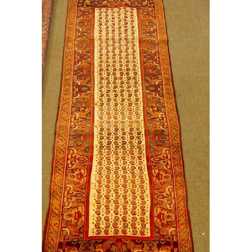 1101 - An Iranian fine woven cream ground wool runner with Mir design, 260 x 100cm