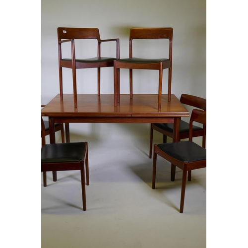 1001 - A mid century Danish teak dining table and six chairs (4+2) by Norgaards Mobelfabrik, the table with... 