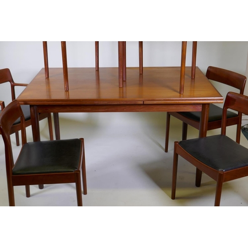 1001 - A mid century Danish teak dining table and six chairs (4+2) by Norgaards Mobelfabrik, the table with... 