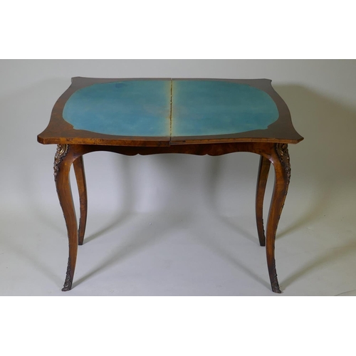 1002 - A C19th figured walnut serpentine front card table, with brass mounts, 92 x 46 x 75cm