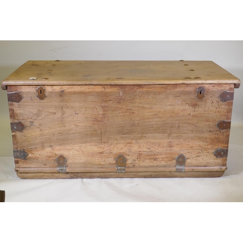 1006 - An antique colonial teak coffer with bronze mounts and carrying handles, 146 x 70 x 68cm