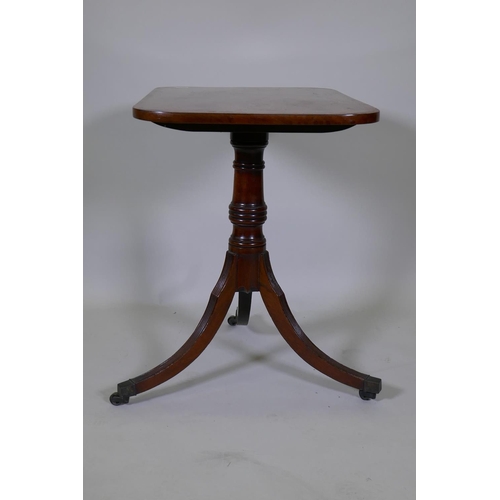 1008 - A Georgian mahogany tilt top table with crossbanded top, turned column and reeded supports, 73 x 49c... 