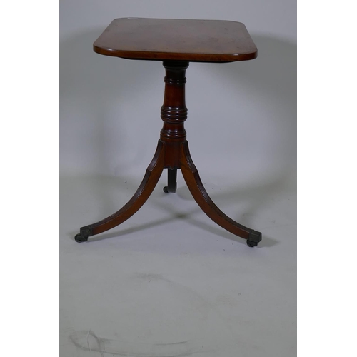 1008 - A Georgian mahogany tilt top table with crossbanded top, turned column and reeded supports, 73 x 49c... 