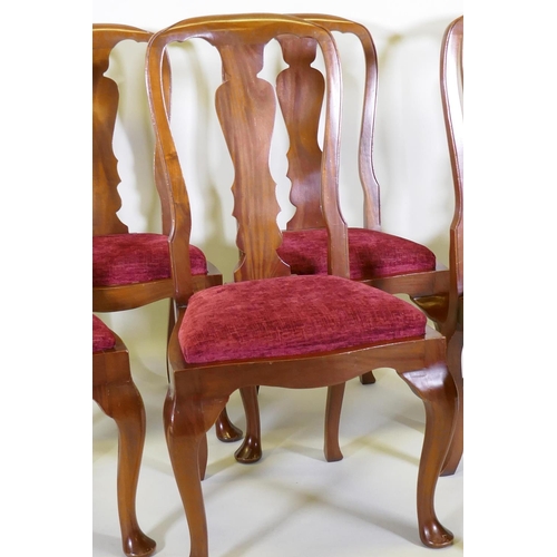 1013 - A set of six mahogany dining chairs with shaped backs and drop in seats