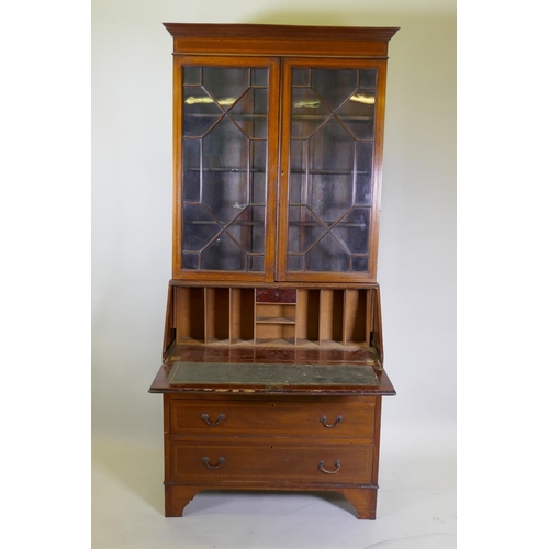 1014 - A Victorian mahogany bureau bookcase with a astral glazed top, the fall front fitted with pigeon hol... 