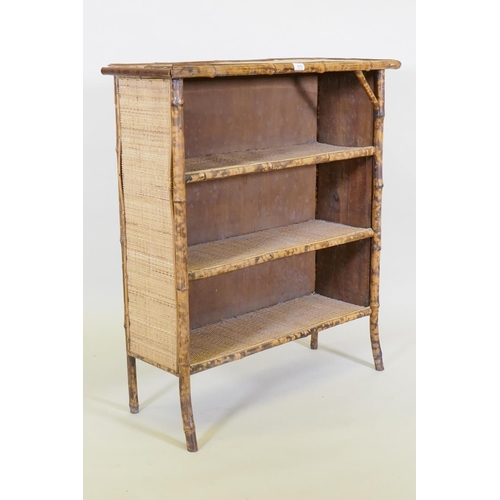 1015 - A bamboo and rattan three tier open bookcase, 88 x 32cm, 100cm high