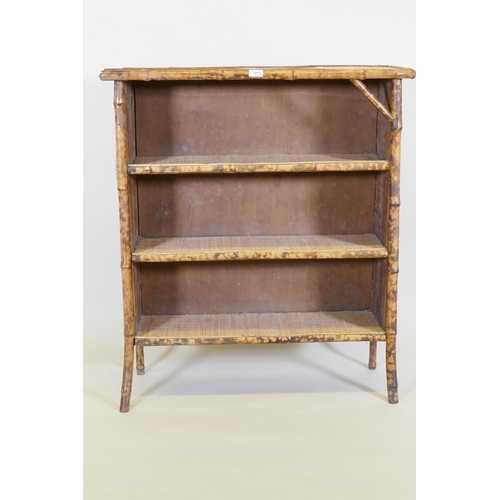 1015 - A bamboo and rattan three tier open bookcase, 88 x 32cm, 100cm high