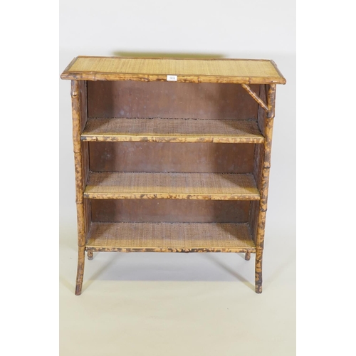 1015 - A bamboo and rattan three tier open bookcase, 88 x 32cm, 100cm high