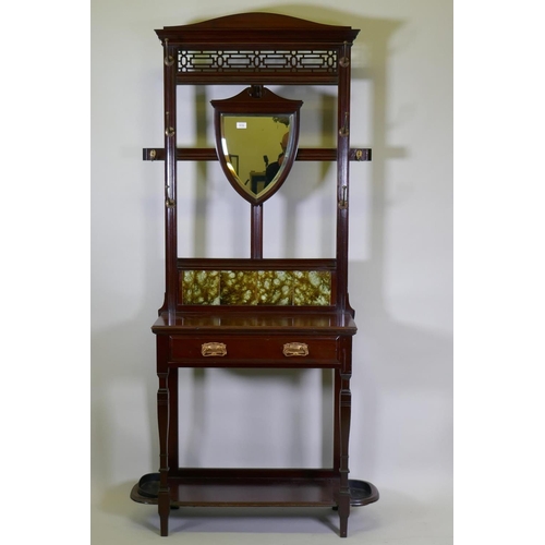 1016 - A Victorian mahogany wall stand with shield shaped mirror, tiled back and single drawer, 92 x 205cm