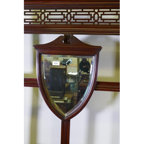 1016 - A Victorian mahogany wall stand with shield shaped mirror, tiled back and single drawer, 92 x 205cm