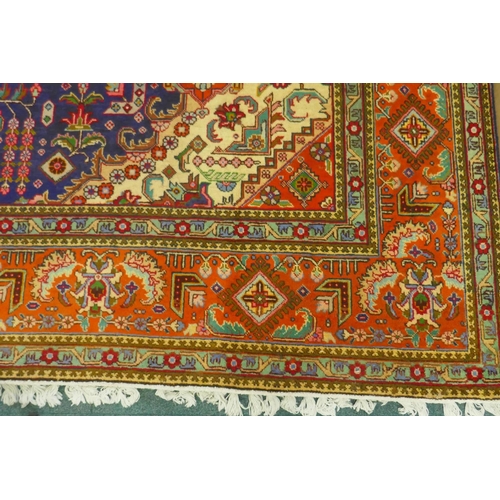 1018 - Large Persian carpet on a rich blue ground and multicolour field, with burnt orange border, Tabriz, ... 