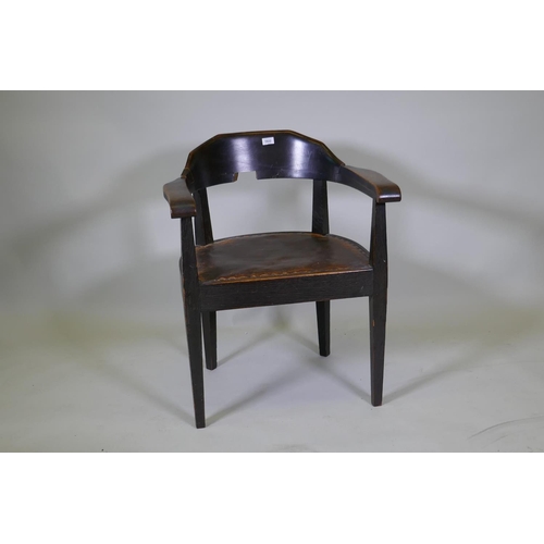 1022 - A late C19th/early C20th German oak tub chair with leather studded seat