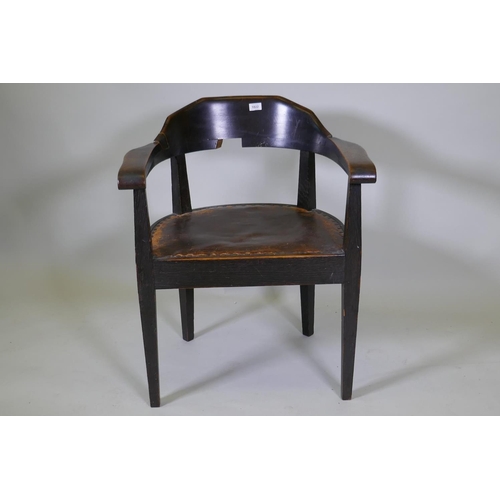 1022 - A late C19th/early C20th German oak tub chair with leather studded seat