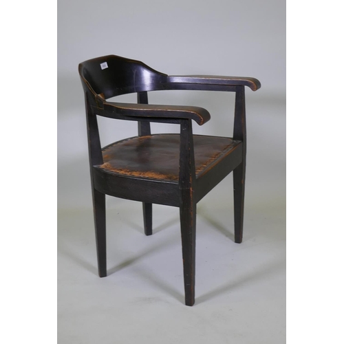 1022 - A late C19th/early C20th German oak tub chair with leather studded seat