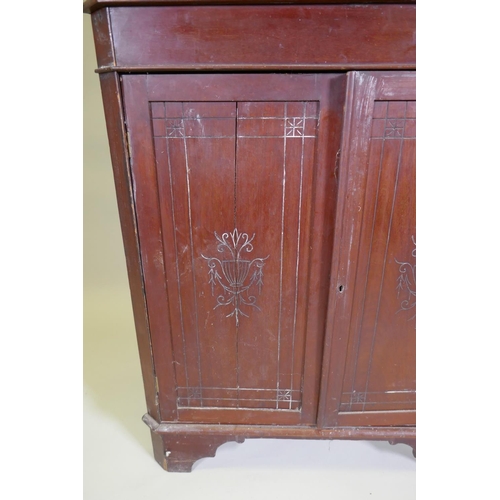 1024 - A Victorian mahogany standing corner cabinet with mirrored back and galleried shelves over two cupbo... 