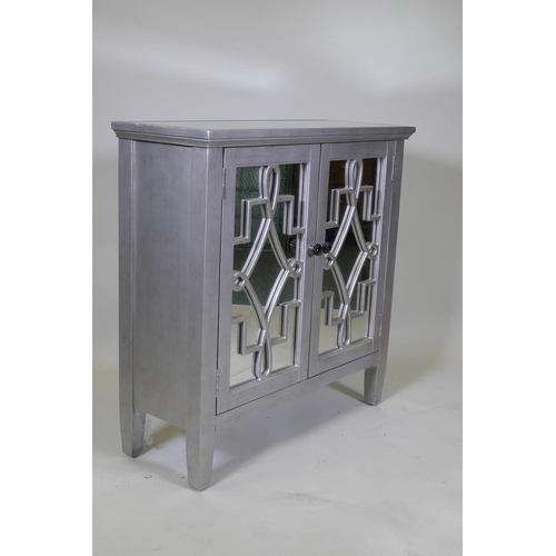 1033 - A contemporary silver leafed side cabinet with mirror glass top and cupboard doors, 82 x 30 x 82cm