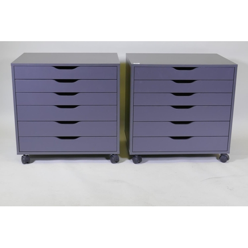 1036 - A pair of contemporary painted chests/filing cabinets with six graduated drawers, raised on castor s... 