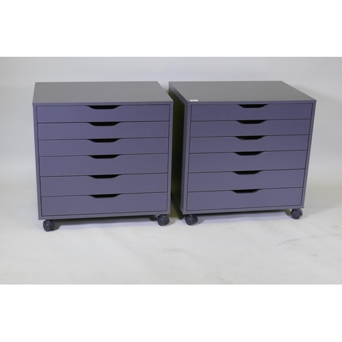 1036 - A pair of contemporary painted chests/filing cabinets with six graduated drawers, raised on castor s... 