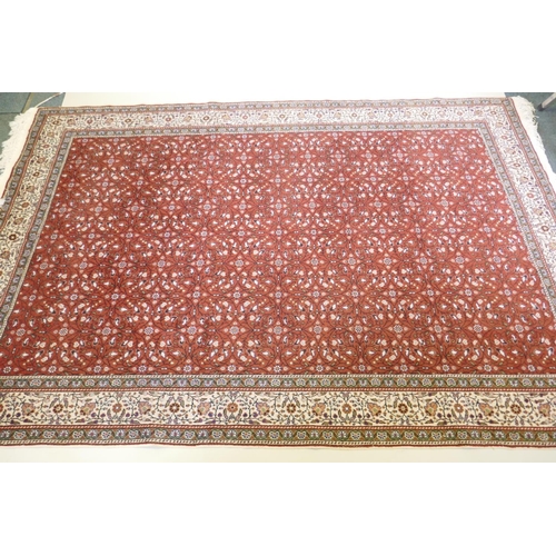 1037 - A terracotta ground wool pile Turkish Erikeh rug with all over design,200 x 290cm