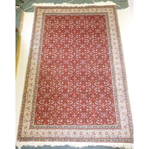 1037 - A terracotta ground wool pile Turkish Erikeh rug with all over design,200 x 290cm