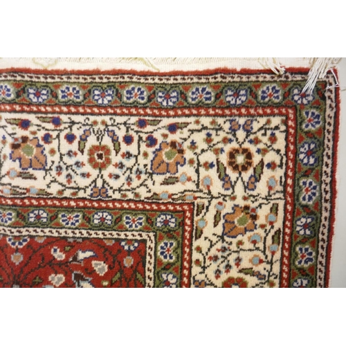 1037 - A terracotta ground wool pile Turkish Erikeh rug with all over design,200 x 290cm