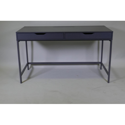 1042 - A contemporary two drawer desk with hinged flap and trunking holes for a PC, 132 x 60 x 76cm