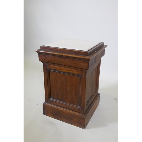 1043 - An oak pedestal with tile top, 38 x 38cm, 55cm high