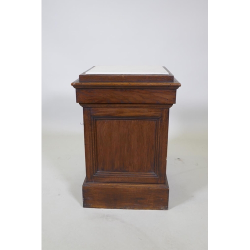 1043 - An oak pedestal with tile top, 38 x 38cm, 55cm high