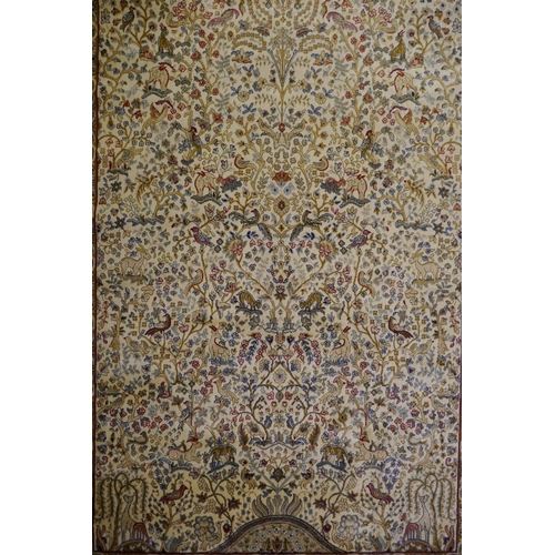 1050 - An ivory ground Kashmir full pile rug with tree of life design with blue borders, 158 x 234cm