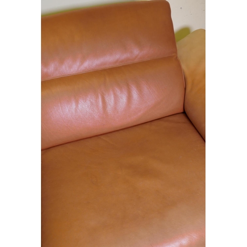 1051 - A Natuzzi leather corner sofa in two sections, with adjustable arms and backs, 316 x 160 x 90cm with... 