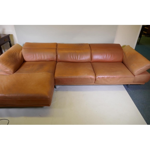 1051 - A Natuzzi leather corner sofa in two sections, with adjustable arms and backs, 316 x 160 x 90cm with... 