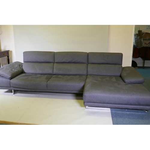 1052 - A Natuzzi corner sofa in two sections, with adjustable arms and backs, and textile upholstery, 316 x... 