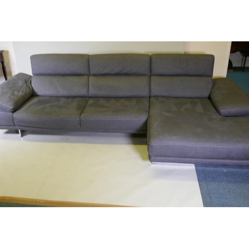 1052 - A Natuzzi corner sofa in two sections, with adjustable arms and backs, and textile upholstery, 316 x... 