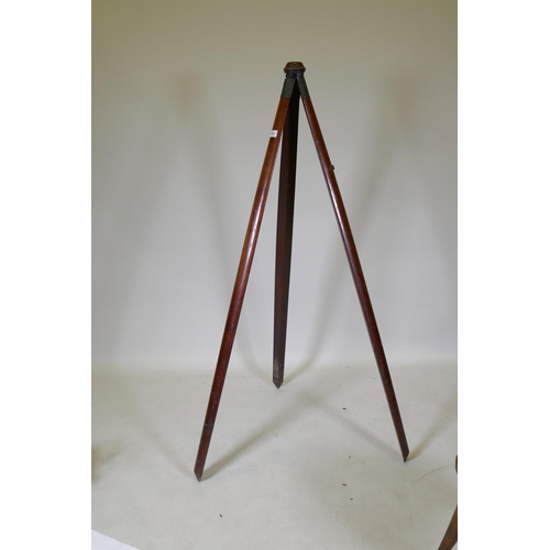 1053 - A C19th mahogany surveyor's tripod/camera stand, with bronze mounts and swivel head, 143cm long