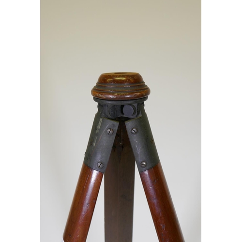 1053 - A C19th mahogany surveyor's tripod/camera stand, with bronze mounts and swivel head, 143cm long