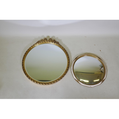 1054 - A mid century gilt wall mirror with bevelled glass, 43cm diameter and a smaller convex mirror